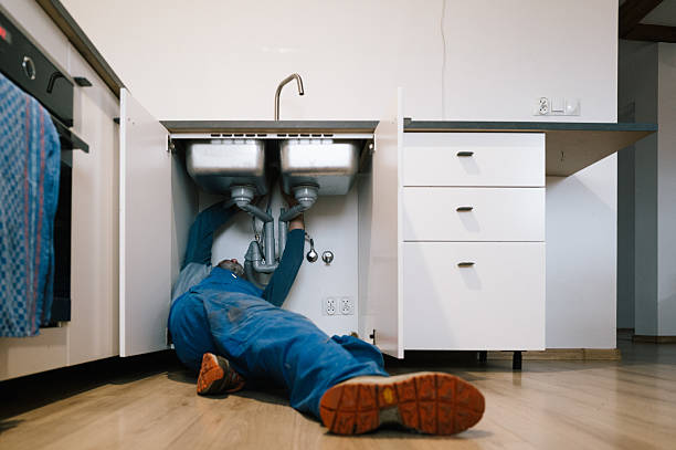 Professional Emergency Plumber technician working in Belding, MI